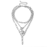 Delicate silver chain necklace adorned with a heart charm, offering a stylish and romantic touch to any outfit.